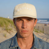 Delaware Beaches Suck DBS Coastal Bethany Hat in sand